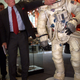 Eugene Cernan, the last man to walk on the moon, touches the visor of the helmet of NASA astronaut Neil Armstrong, first man on the moon at an exhibit in Frankfurt, July 20. The exhibtion marks the 30th anniversary of the Apollo 11 moonwalk.